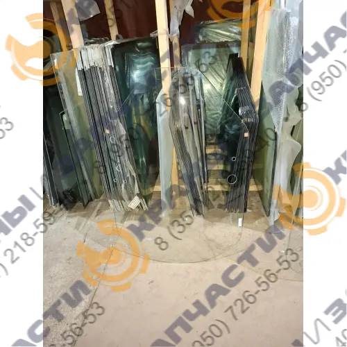 Стекло лобовое T312628 1155х450/ 1135х402, 11/9 отв. 2018 г. John Deere 312GR–328D